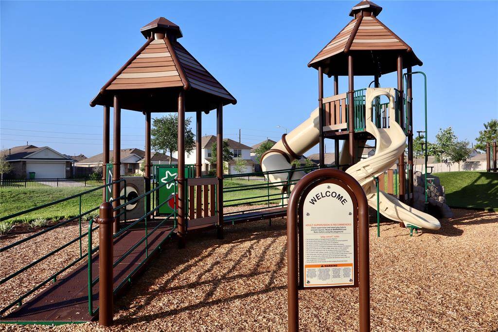A delightful play area with swings and slides for young children.
