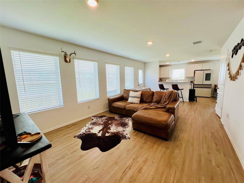 Experience the elegance of luxury vinyl plank flooring, seamlessly covering the entire first floor.