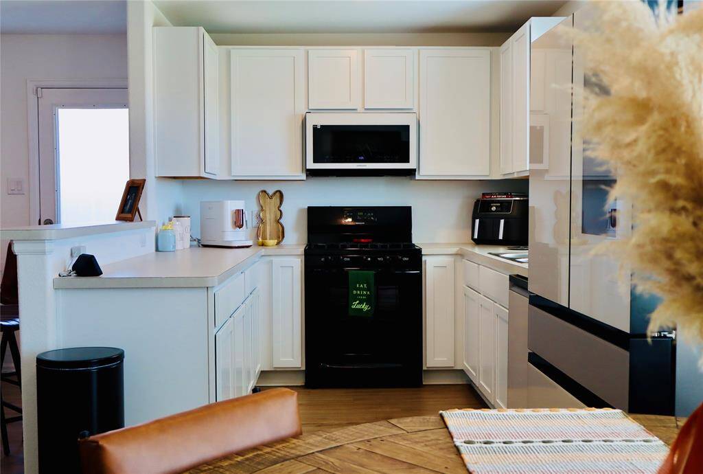 Discover a chef's dream kitchen with abundant counter space and ample cabinetry.