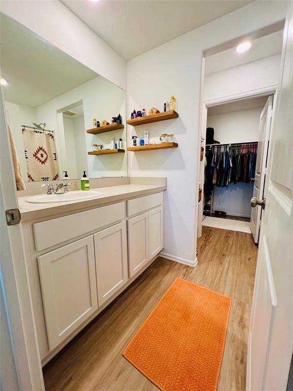 Elegant primary bathroom featuring a modern shower/tub combo with an upgraded shower head.