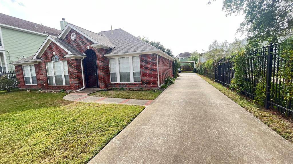 Beautiful brick home with plenty of yard and parking