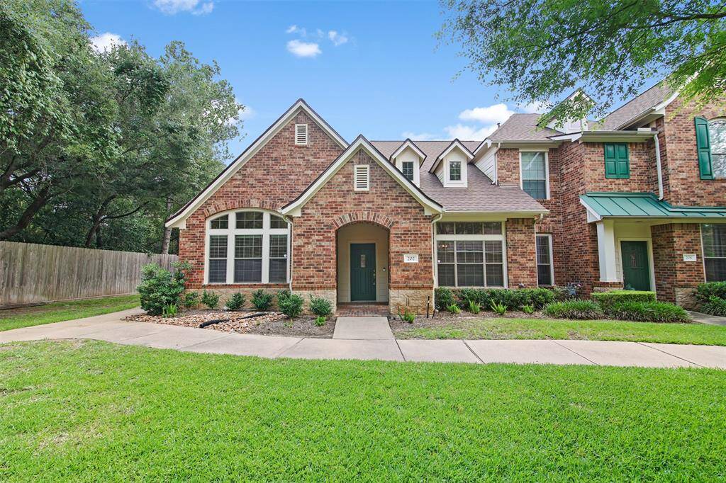 Charming one story townhome on a corner lot in Green Trails.