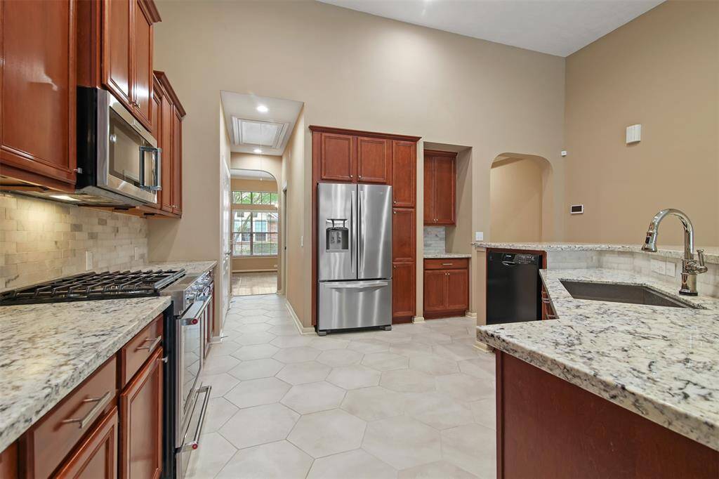 The kitchen features hexagon tile floors, butler's pantry and lots of storage space.