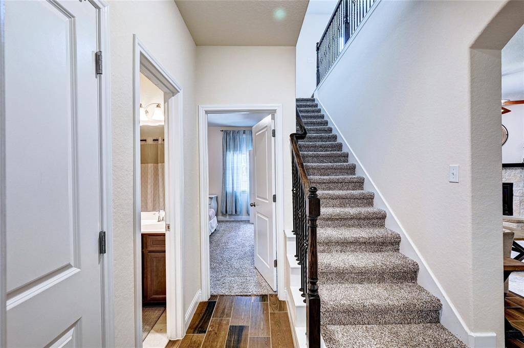 Hallway/Stairs leading to Gameroom/Media & 1/2 Bath Upstairs