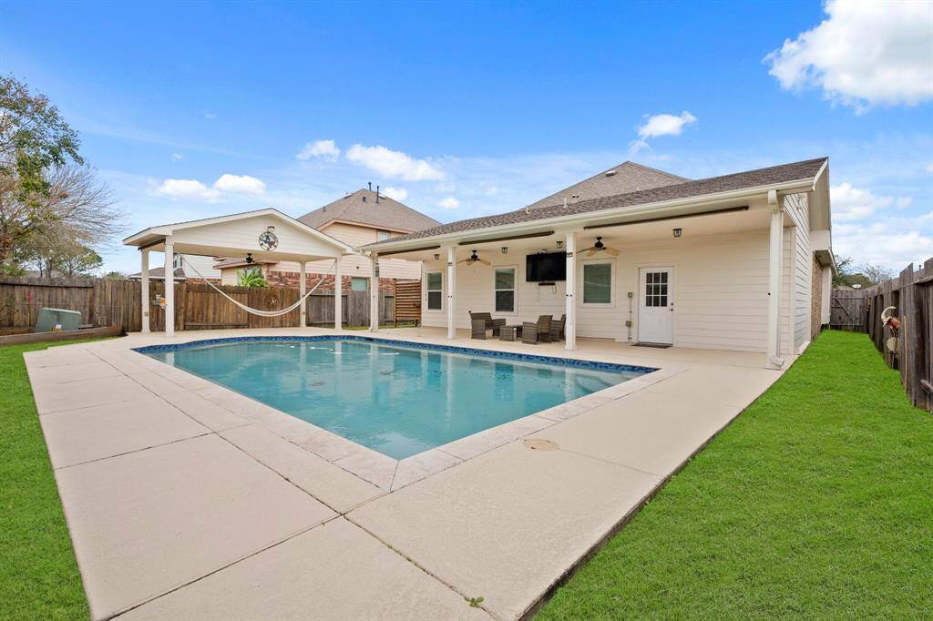 view of pool with 2 patios