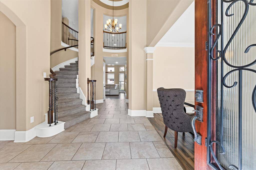 Make a grand entrance in dramatic two story foyer