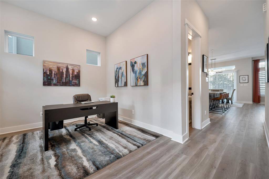 As we enter the home we are greeted by the open plan home office.