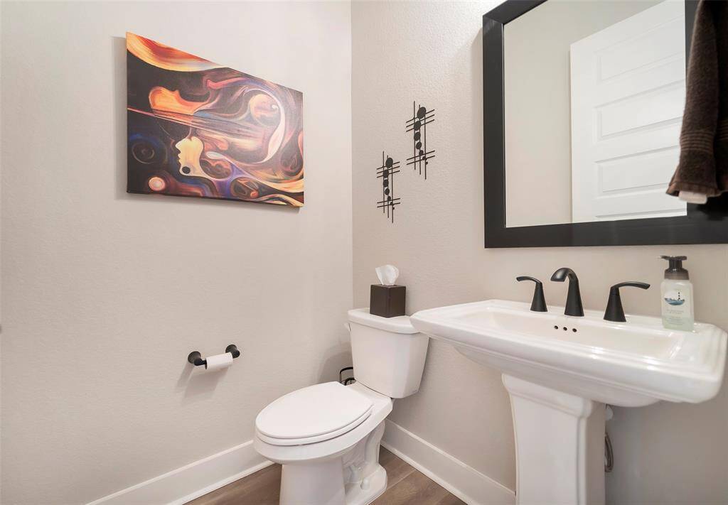 Sizeable powder room serves the first floor and completes our tour of the first floor.