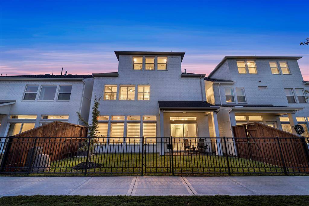 The spacious gated rear yard on a private green space.