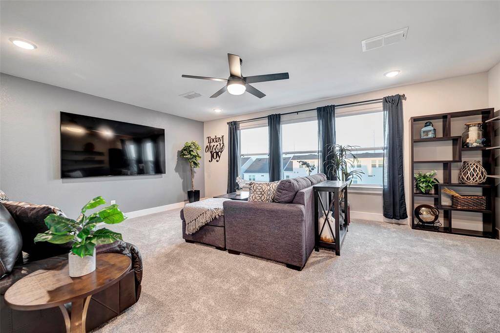 This large room can be used as a games room, movie room or be converted into a home exercise area!