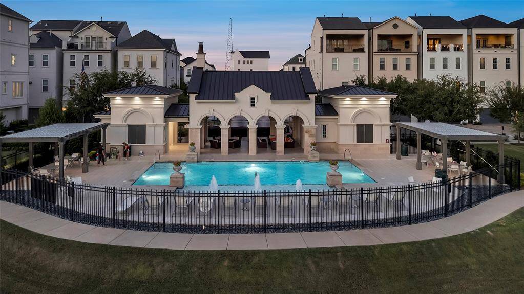 The resort style pool features pergolas to shade from the heat and a community building complete with seating & fans to cool of by.