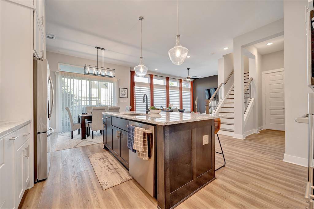 Stunning oversize island with granite countertops & double sink.