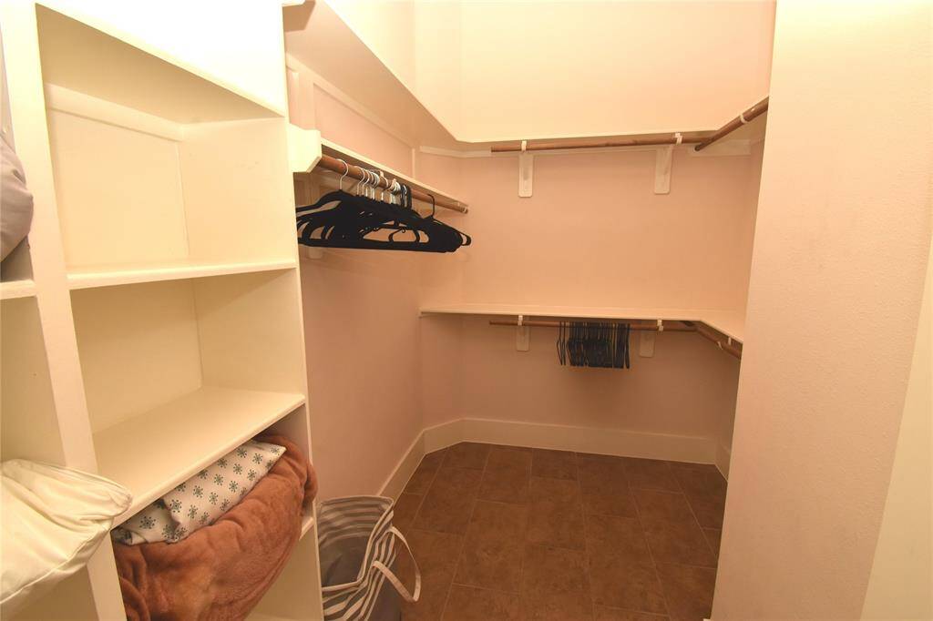 One of the two walk-in master bedroom closets
