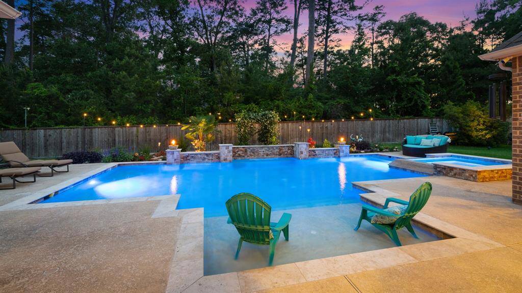 Make this gorgeous backyard oasis yours! Custom saltwater pool, spa, outdoor kitchen, 2 covered porches, pool bath and MORE! Private half acre lot with exquisite landscaping! The flowering jasmine smells amazing! Don't miss this one.