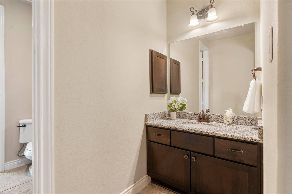 Bedroom 3 vanity area with granite countertop and cabinets.  Again, there's room for storing all of your bathroom items.