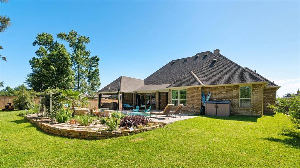 Overlooking the backyard from the rear corner of the lot.  Your yard will look beautiful even in the heat of the summer.  Fully automated  irrigation system for the front and backyard with the Rachio sprinkler system that's Wi-Fi enabled.