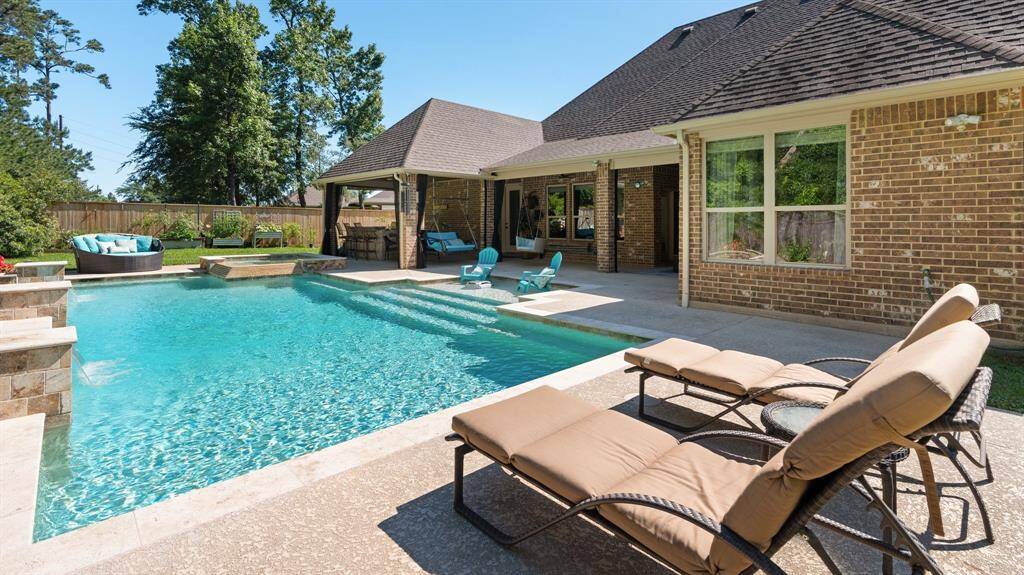 Make this your backyard retreat!  The sparkling saltwater pool is oversized.
