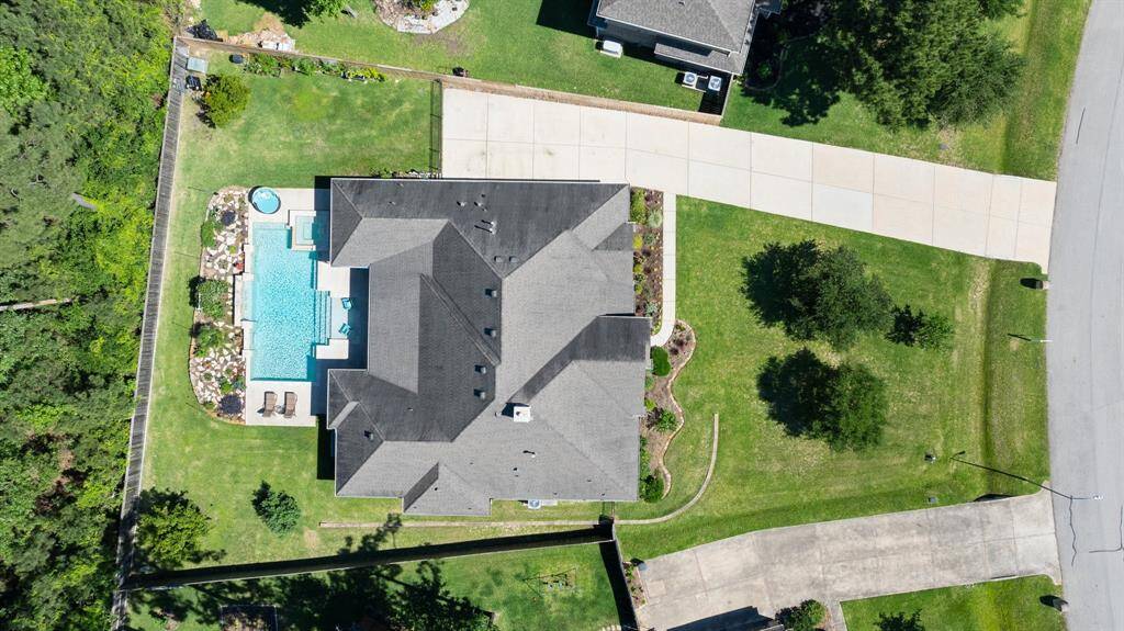 Aerial view of 40377 Mostyn Drive. Located minutes away from all of the new development in Magnolia, close to SH 249, easy access to Houston, and close to Lake Conroe!