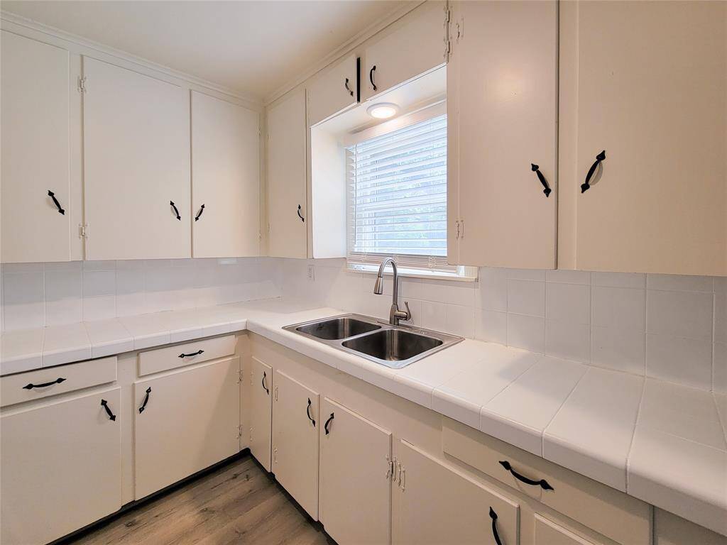 New stainless sink and 2 inch faux wood blinds.