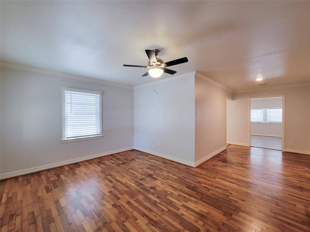 Living area opens to dinning room or flex space with recent refinished hardwoods and fresh paint.