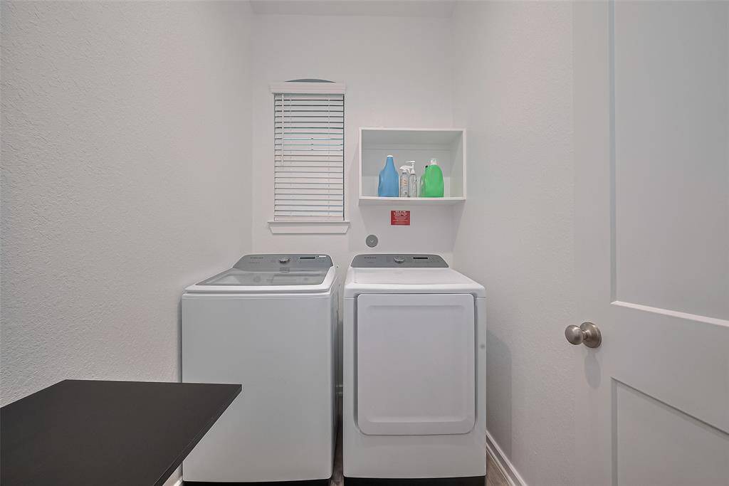 Utility room with washer & dryer included