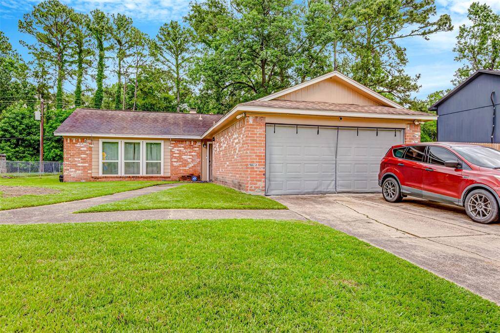 Charming brick home with a spacious two-car garage, nestled in a serene neighborhood. Enjoy the lush front lawn and inviting curb appeal, perfect for family living.