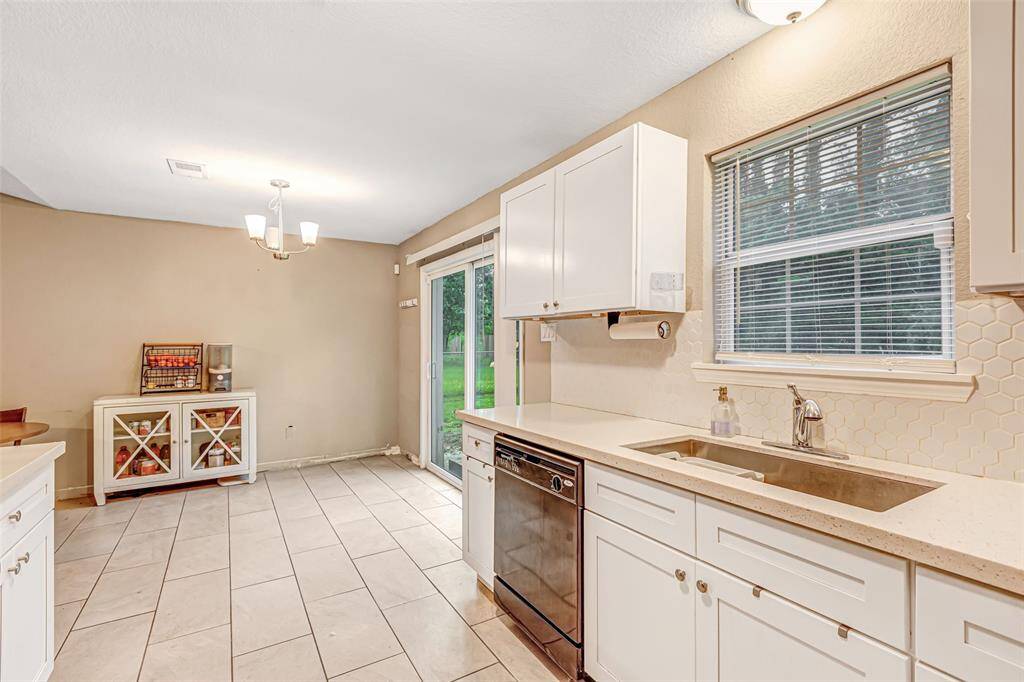 Bright kitchen with a cozy breakfast area and ample natural light.