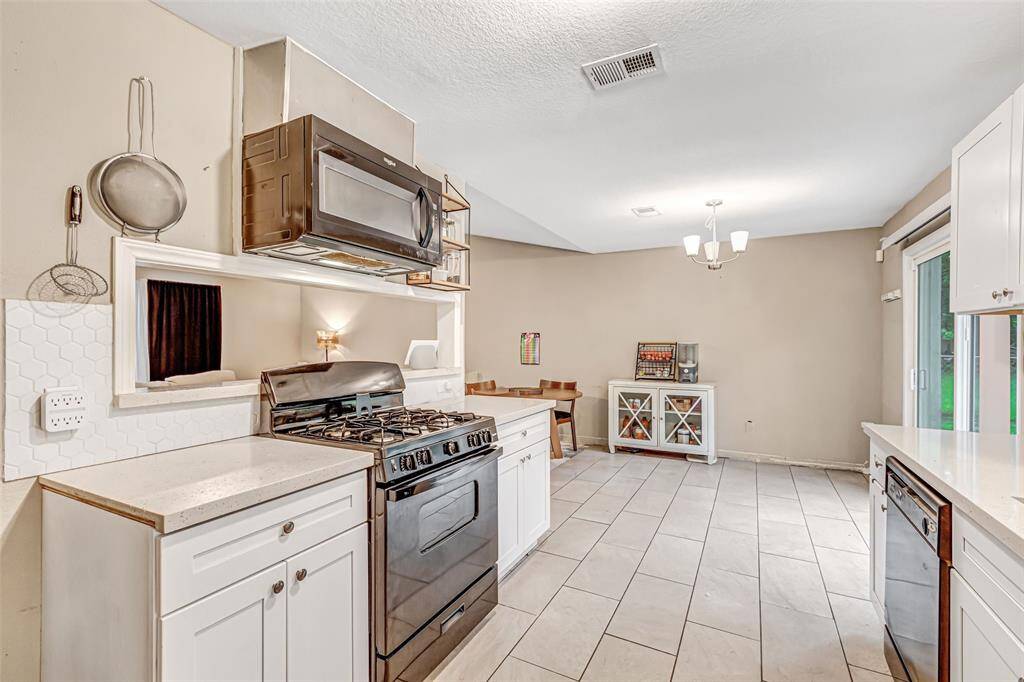 Spacious kitchen with modern appliances, ample storage, and a bright, open layout perfect for entertaining.