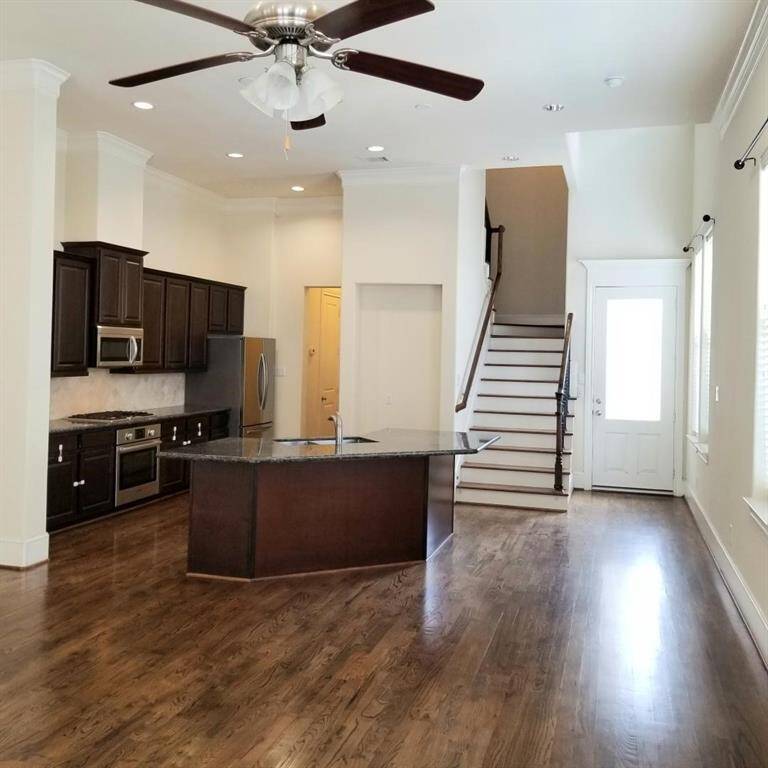 HUGE Den...Open floor plan...Wooden Floors & Fan.