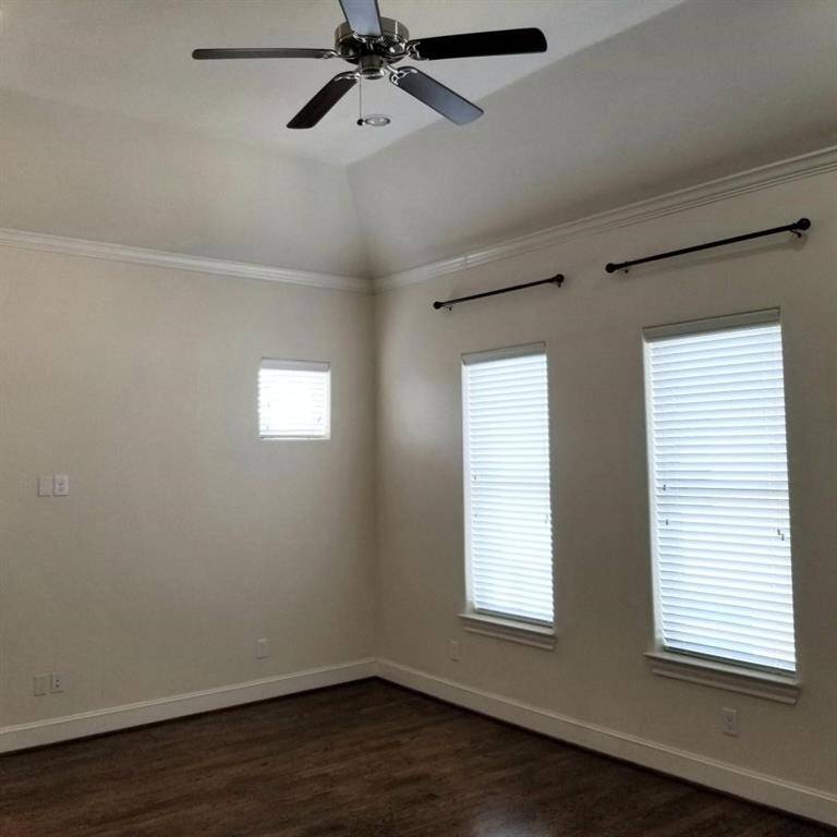 Master Bedroom with Wooden Floors and Fan. All Windows have 2" Blinds.
