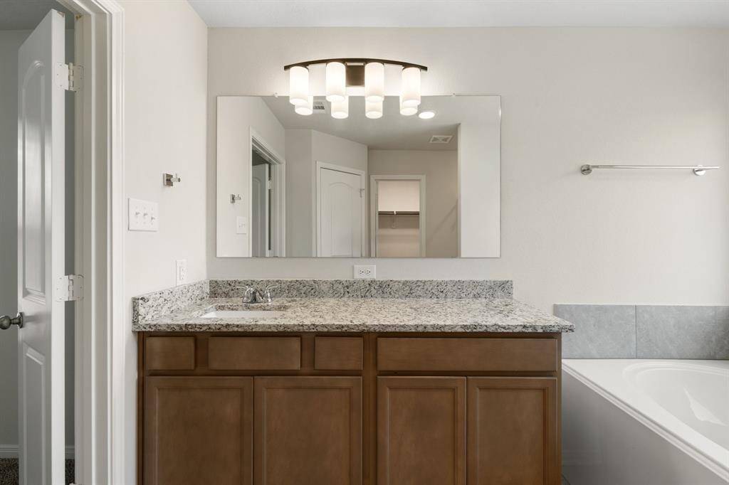 Granite countertops, sleek cabinetry and contemporary finishes are the cherry on top in here.
