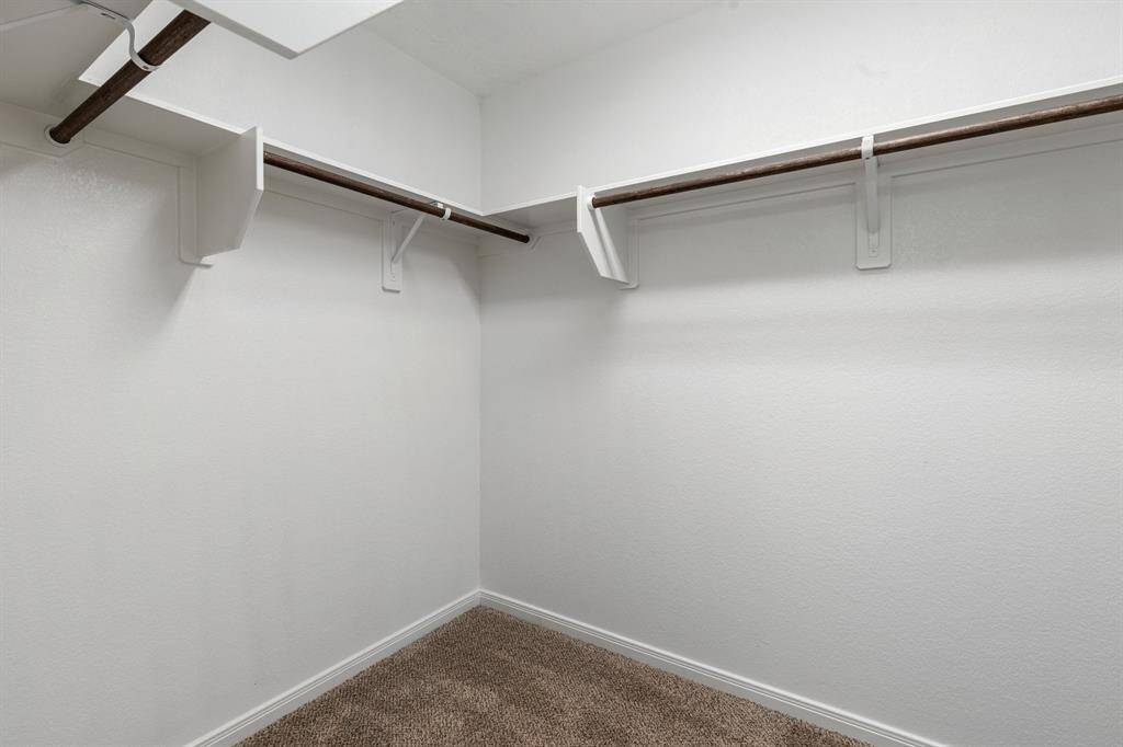 There's a walk-in closet attached to the primary bathroom, which makes for a great spot for your wardrobe or accessories.