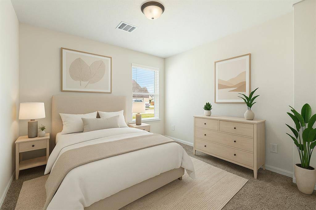 A spacious second bedroom with a closet. This room is virtually staged.