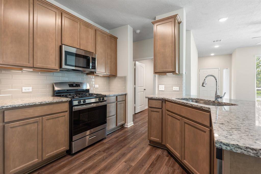 The kitchen is a true delight, equipped with modern appliances in flawless condition, stylish cabinetry, walk in pantry, and plenty of counter space for culinary adventures.