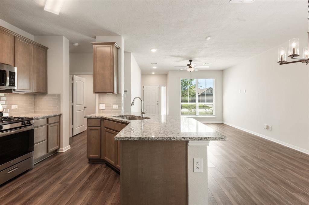 An open floor plan seamlessly connects the main living areas, creating a welcoming and airy atmosphere.