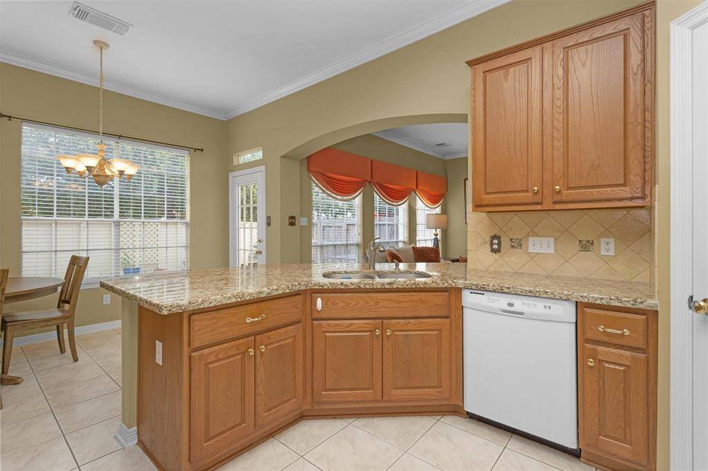 Breakfast bar separates kitchen from breakfast area