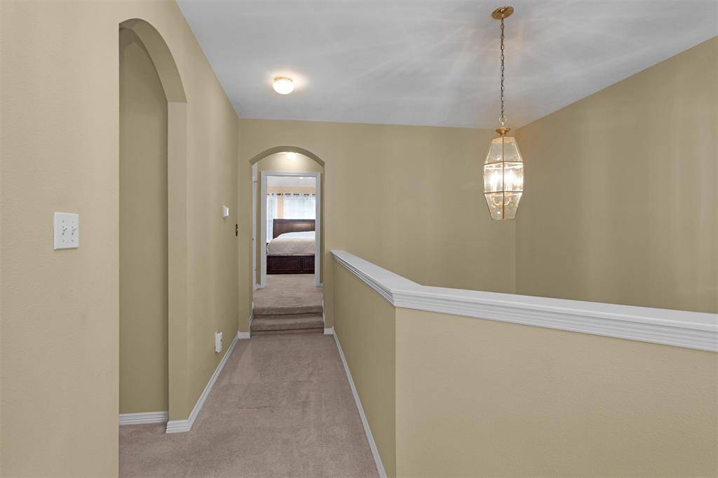 Upstairs hallway looking towards primary suite