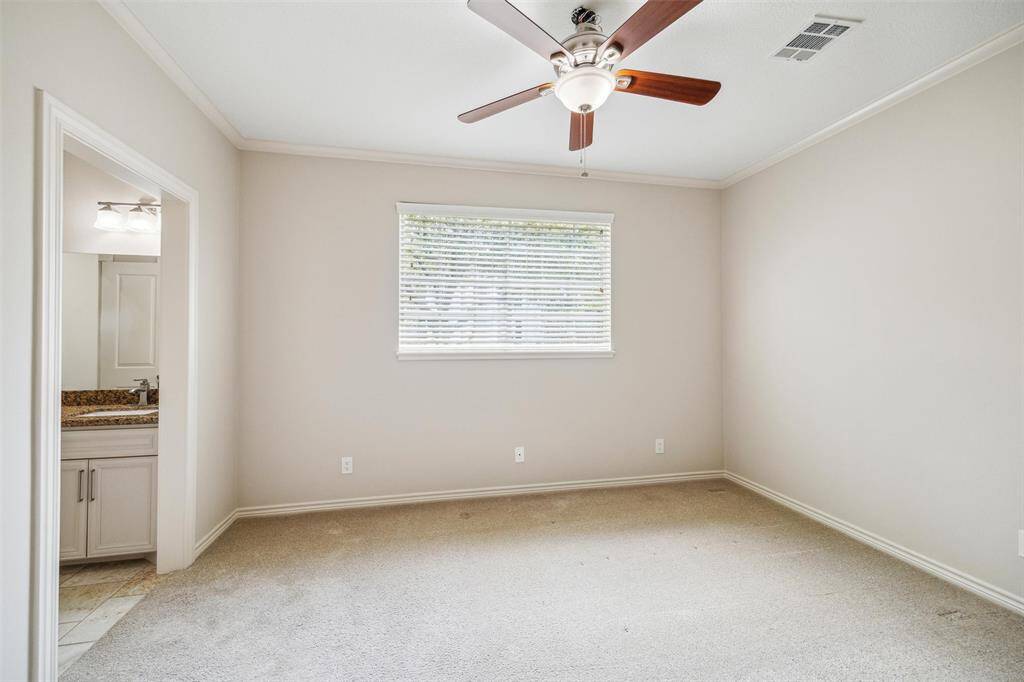 Bedroom located on the first floor features a Jack and Jill bathroom.