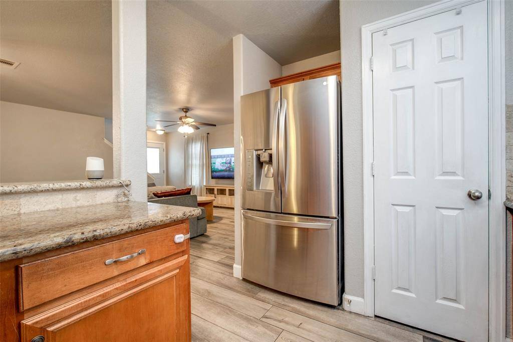 Open floor plan with kitchen open to the dining and living room