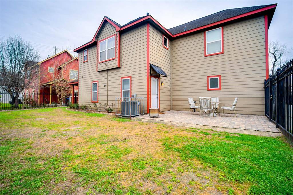 View of the backyard with paved patio
