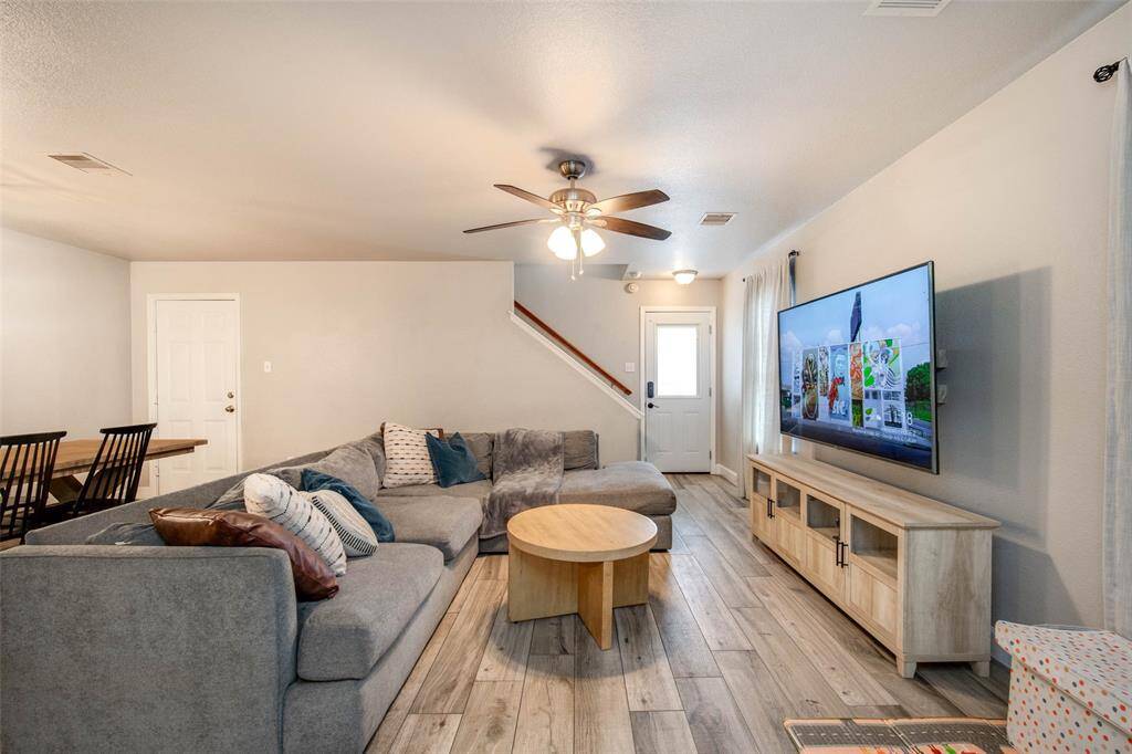 Updated flooring in the living with tons of natural lighting