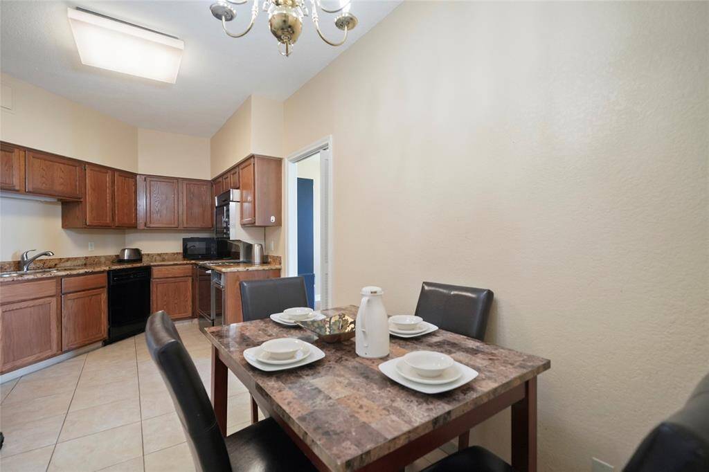 This cozy breakfast area is perfect for casual meals or a quiet cup of coffee to start the day, with easy access to the kitchen just steps away.