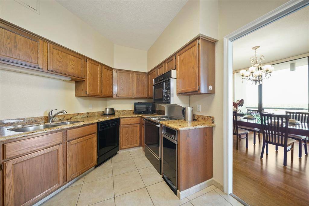 Different angle of the kitchen. Showing its direct connection to the dining area, making it easy to serve meals and stay connected while entertaining.