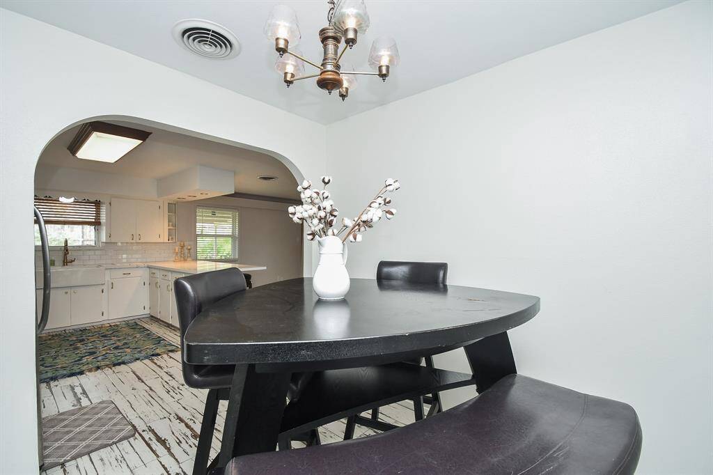 Don't you love the wide arched doorway into this casual area?