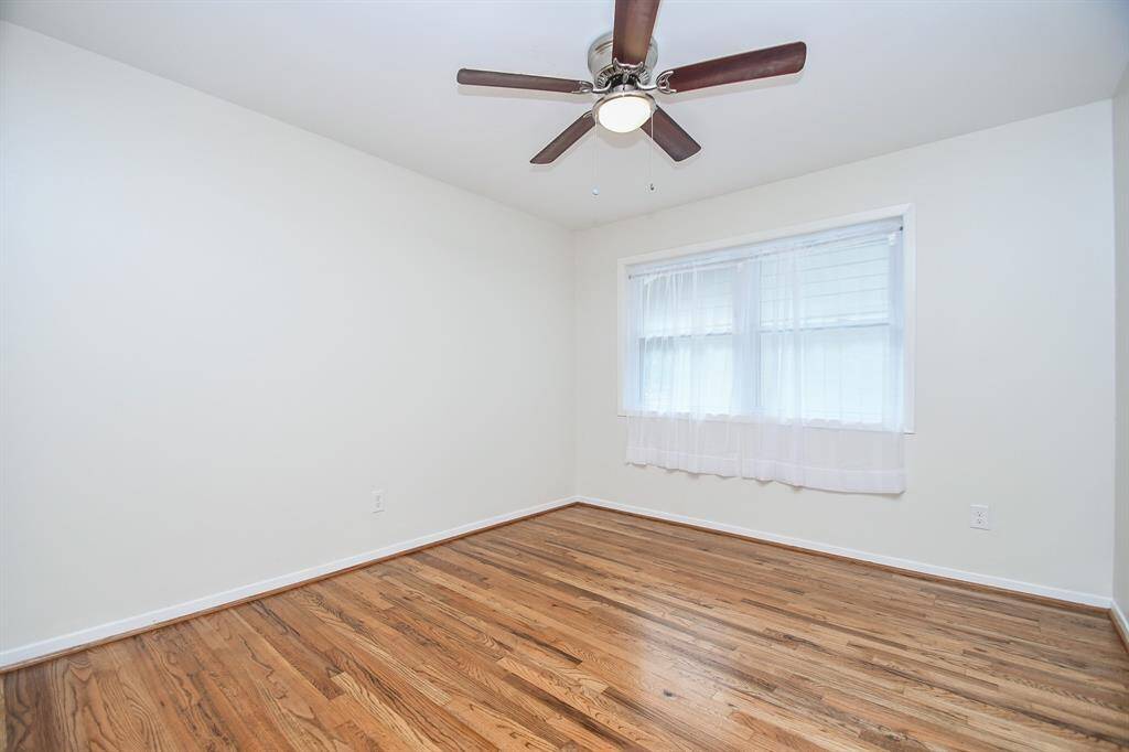 There's more nice natural light in this bedroom from large double windows.