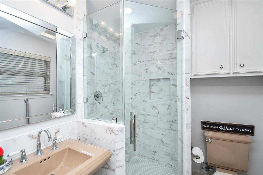 A dynamic second bath offers contemporary shower appointments.