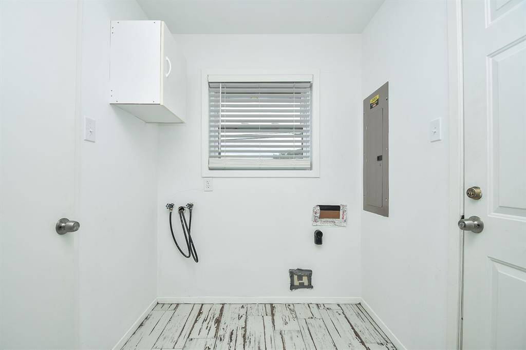 Even your utility room is pristine and ready to serve, with hook-ups for your laundry appliances, handy storage above, and a welcomed window for natural breezes.