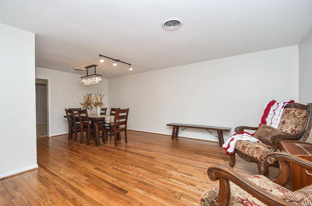 This huge front room, off the main hallway. offers so many options, including a spacious formal dining area and/or pleasant sitting room.