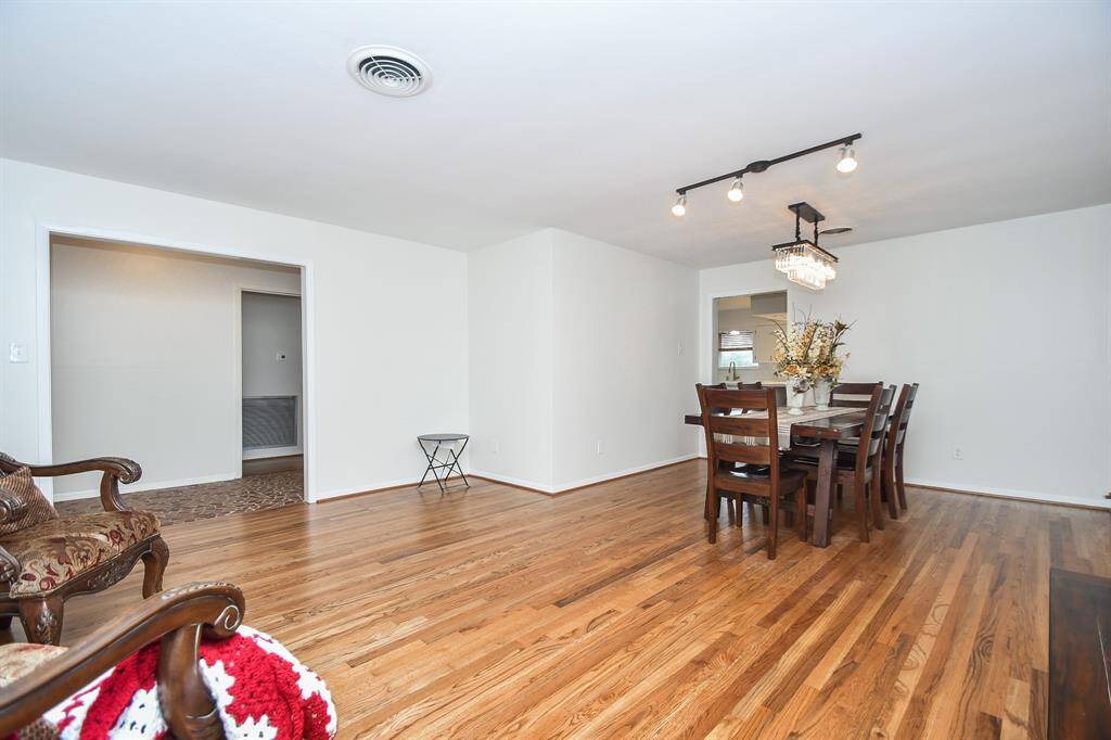 The wise and timeless benefits and beauty of the open floor plan design concept never get old, as seen here in this huge front dining area, with direct access to your chef's kitchen.