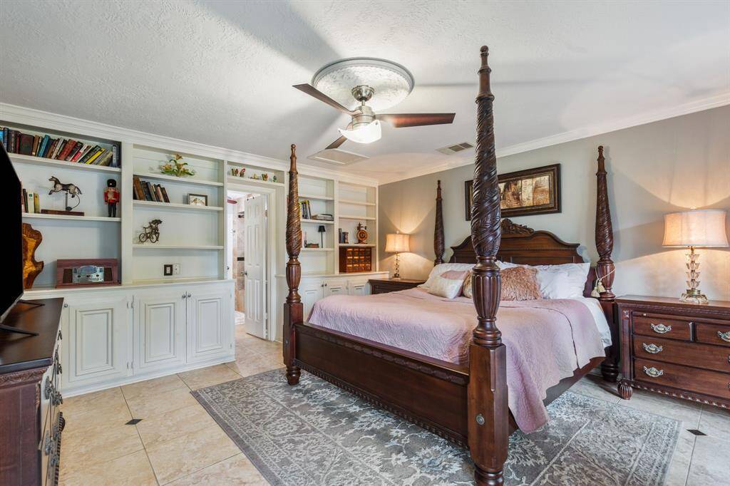 First floor primary suite is complete with built-in storage and great space